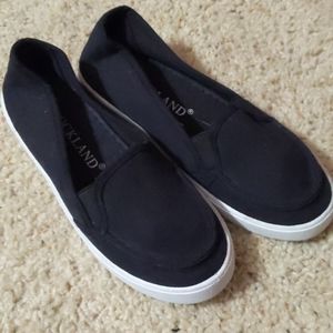 Kids black slip ons never used size 5